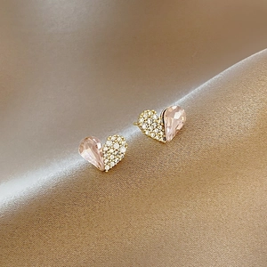 Sweet pink crystal and white zircon heart stud earrings in a gold setting