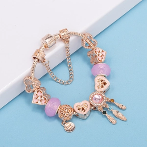Rose gold snake chain bracelet with pink heart charms and dreamcatcher feather pendant