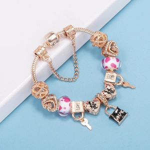 Rose gold charm bracelet with heart locket and LOVE pendant on a snake chain