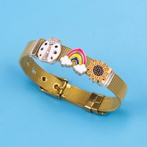 Golden mesh bracelet with rainbow, sunflower, and ladybug charms on a blue background