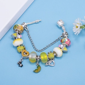 DIY silver bead bracelet featuring summer fruit charms, panda pendant and lemon slice