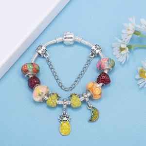 Tropical fruit charm bracelet with silver snake chain featuring colorful enamel pendants