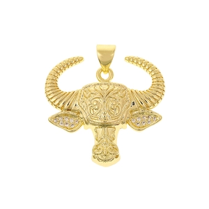 Macro detail of 18K gold plated bull head pendant with white zircon inlays and vintage relief