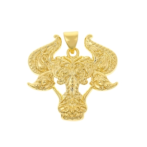 Detailed view of an 18K gold plated bull head pendant with intricate floral engravings