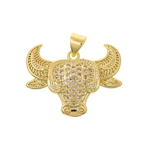 Close-up of gold bull head pendant with micro-paved zircons and embossed horn textures