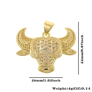 Detailed macro of 18K gold plated bull head pendant with zircon stones and dimensions