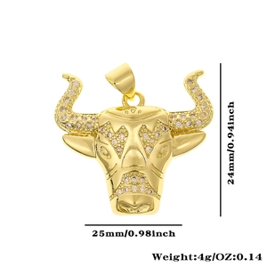 Detail view of 18K gold plated bull head pendant with champagne cubic zirconia inlays