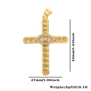 Detailed view of golden cross pendant with curb chain texture and evil eye center stones