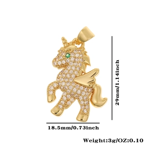 Golden unicorn pendant with white zircons and green eyes, size 29mm by 18.5mm