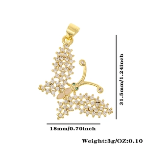 Detailed view of dragonfly pendant with gold plating and dimensions 18mm by 31.5mm