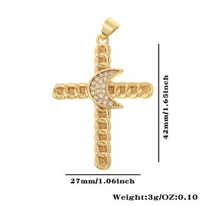 Macro detail of gold cross pendant with crescent moon and white zircon stones
