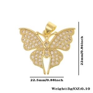 Detailed view of a gold-tone dragonfly pendant with clear cubic zirconia pavé and dimensions