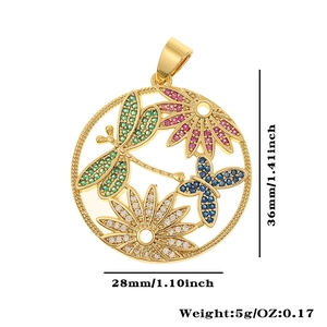 Detailed view of hollow gold dragonfly and butterfly pendant with colorful zircons