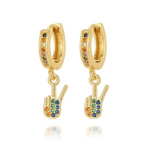 Macro shot of 18K gold plated huggie earrings with rainbow zircon peace sign charms