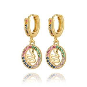 Detail of gold snake pendant earrings with multicolor zircon stones and rainbow crystals