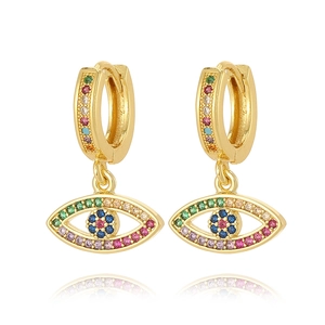 Detailed macro view of gold-plated evil eye earrings with colorful zircon stones