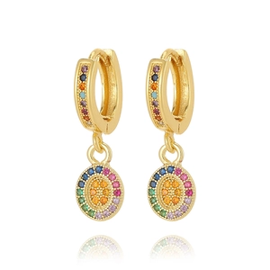 Detail of gold hoop earrings with sparkling rainbow cubic zirconia in a circular design