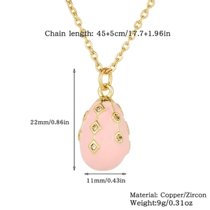 Detailed view of pink enamel egg pendant with gold accents and cubic zirconia dimensions