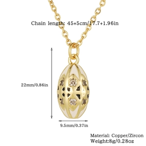 Detail view of gold vintage egg pendant showing dimensions 22x9.5mm with zircon inlay