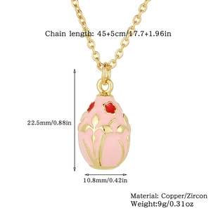 Detailed view of pink enamel Easter egg pendant with gold floral patterns and dimensions