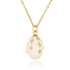 Detailed close-up of 18K gold plated egg pendant with white enamel and sparkling zircons