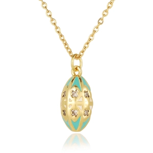 Macro detail of oval egg pendant with blue enamel, gold filigree and crystals