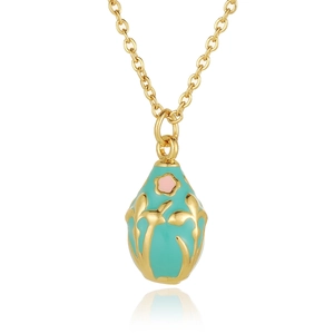 Macro view of mint green enamel egg pendant with gold floral patterns and pink flower