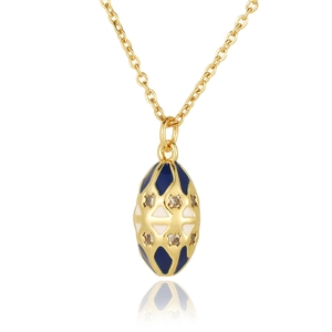 Macro detail of Faberge style egg pendant with blue enamel and sparkling crystals