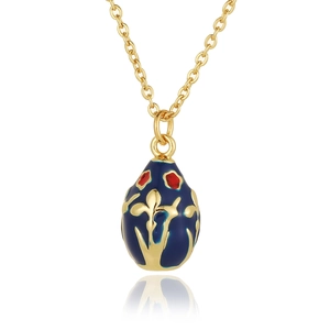 Detailed close-up of 18K gold-plated egg pendant with blue enamel and floral patterns
