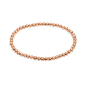 Macro detail of minimalist rose gold beaded bracelet with high-polished mirror finish