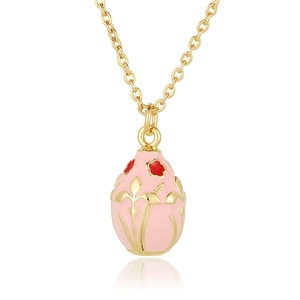Detailed macro view of 18K gold plated necklace with pink enamel floral egg pendant