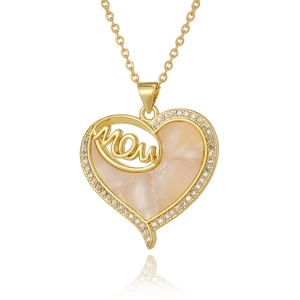 Detailed macro view of heart-shaped MOM pendant with shimmering inlay and crystals