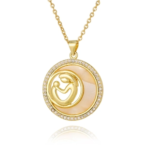 Macro detail of gold-plated mother and child pendant with shimmering mother of pearl inlay
