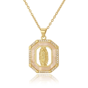 Macro detail of gold Mother Mary pendant with zircon pavé and pearl shell inlay