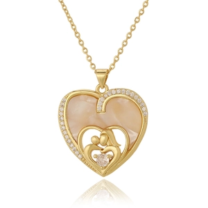 Detail of gold heart pendant featuring a mother and child embrace with sparkling zircons