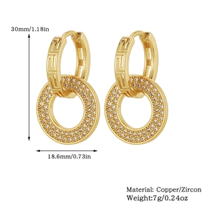 Detailed view of 18K gold plated hoop earrings with Greek key patterns and zircon pendants
