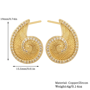 Detail view of gold-plated shell earrings with cubic zirconia and dimension labels