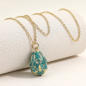 Vintage peacock green egg pendant necklace with gold floral enamel and zircon stones