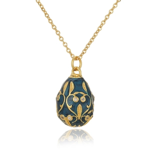 Close-up of vintage Russian egg pendant in 18K gold plating with green enamel and zircons