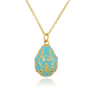 Detailed macro view of 18K gold plated Russian egg pendant with light blue enamel and zircon