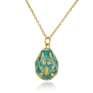Detail of teal enamel Russian egg pendant with gold vine lines and zircon inlays