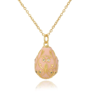 Detailed close-up of Russian egg pendant in pink enamel with gold-plated filigree patterns