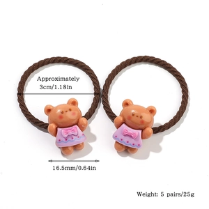 Detail shot of brown elastic hair ties with cute cartoon bears and size measurements