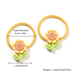 Detail van zonnebloem haarelastiekjes met een diameter van 3cm en bloemen van 17mm