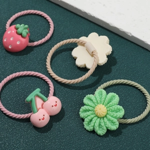 5 pairs of girls hair ties featuring pink strawberry, cherry, and floral resin charms