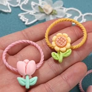 Handset met 5 paar schattige elastische haarbandjes met tulpen en zonnebloemen voor baby's
