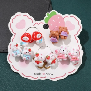 Close-up of 5 pairs of kids elastic hair bands featuring cute resin animal and fruit charms