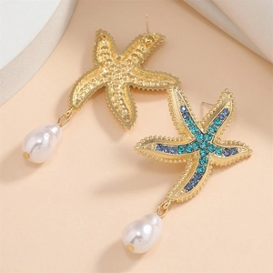 Golden starfish earrings with blue rhinestones and white drop pearl charms