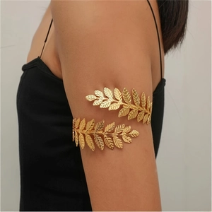 Elegant gold leaf armlet with spiral laurel design worn by a female model