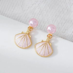 Pink shell earrings with faux pearl studs and gold trim finish in a high-quality macro view